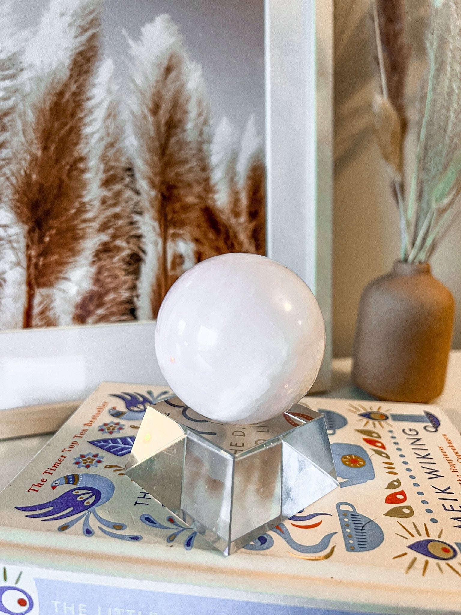 pink mangano calcite sphere on stand