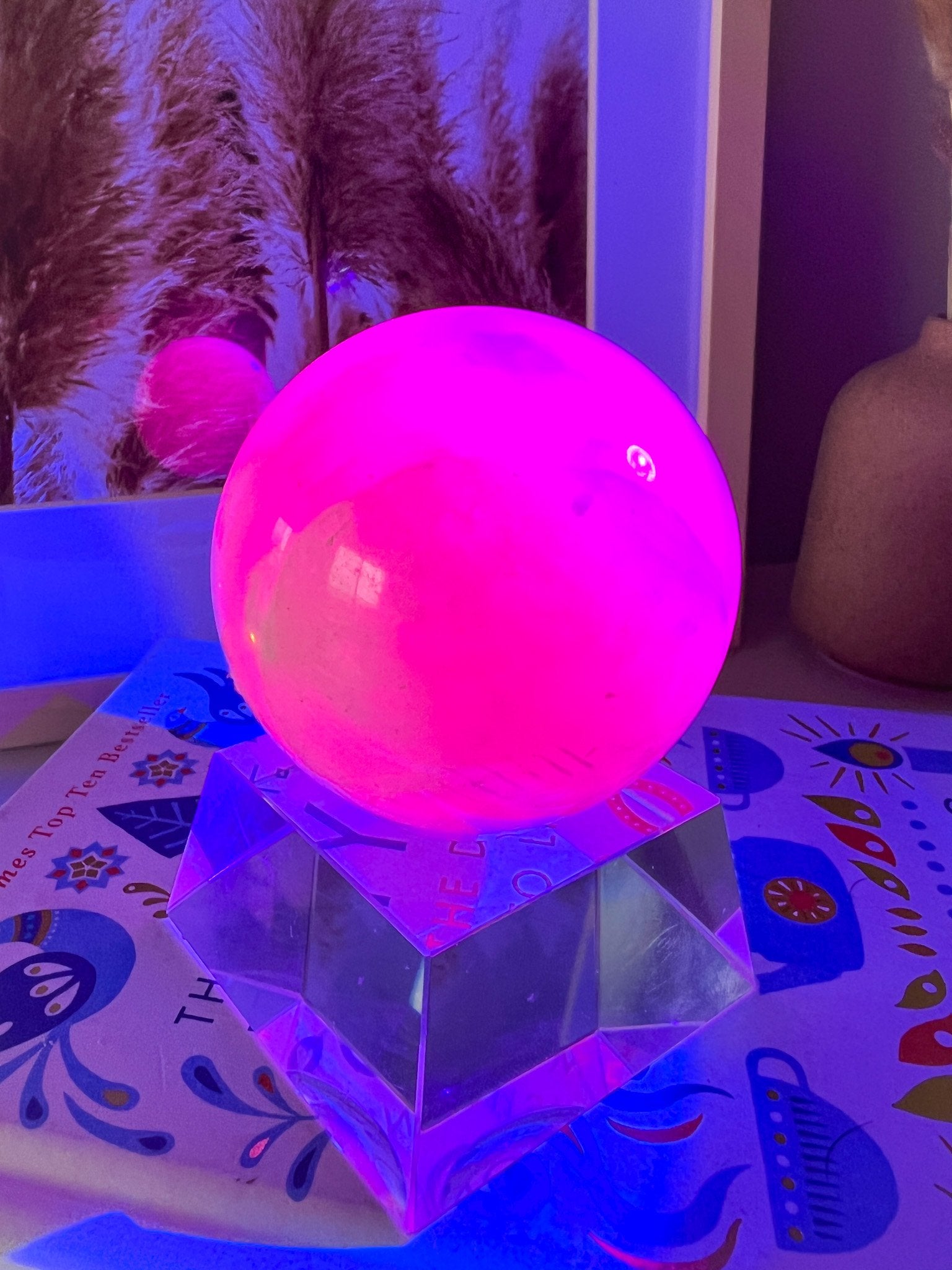 pink mangano calcite sphere on stand